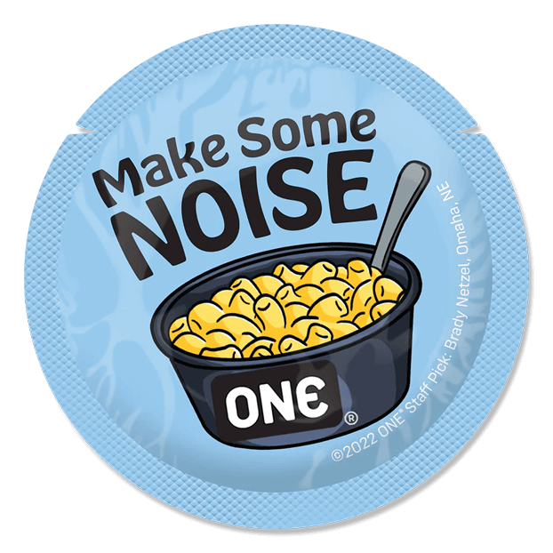 ONE brand macaroni and cheese packaging with 'Make Some Noise' text on a blue background condom wrapper