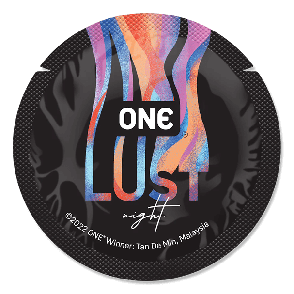 Condom package with colorful design and 'ONE LUST' branding on a black background
