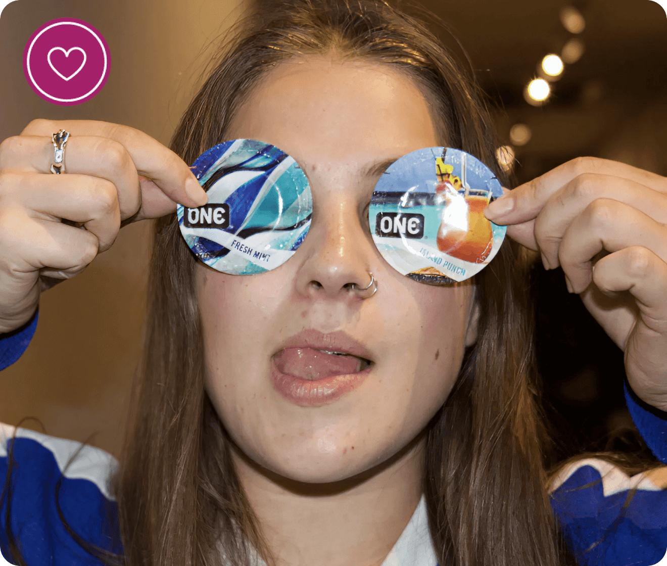 Person wearing novelty sunglasses with colorful designs and text.